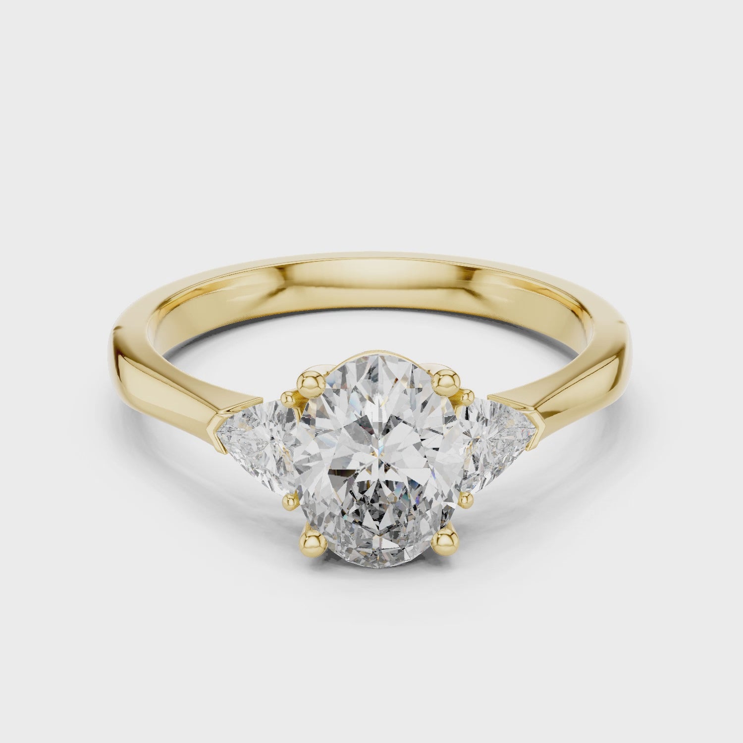 White Gold Oval Cut Diamond Engagement Ring with Tapered Trilliant Stones
