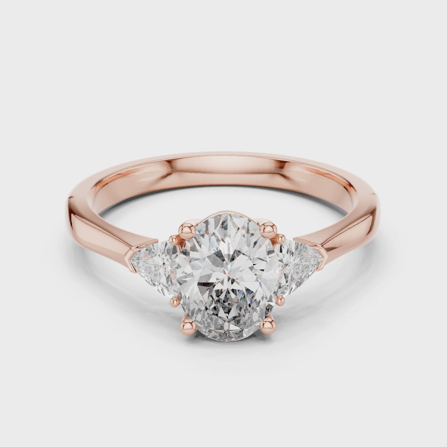 White Gold Oval Cut Diamond Engagement Ring with Tapered Trilliant Stones