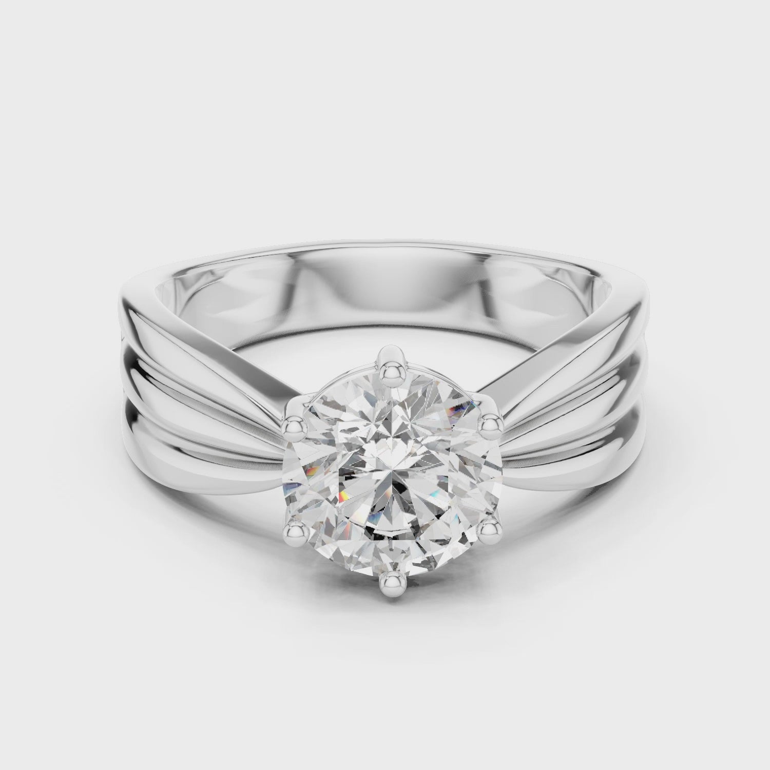 Modern White Gold Solitaire Ring with Sculpted Band